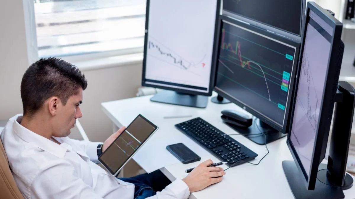 Office desk with multiple monitors