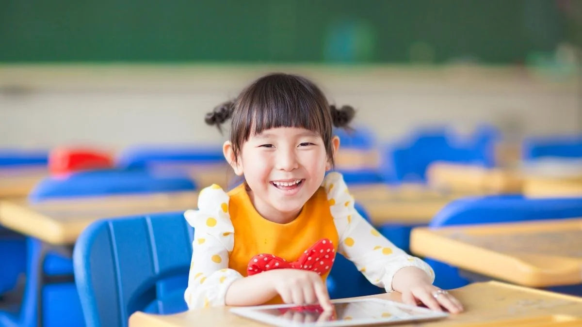 Child using tablet at school