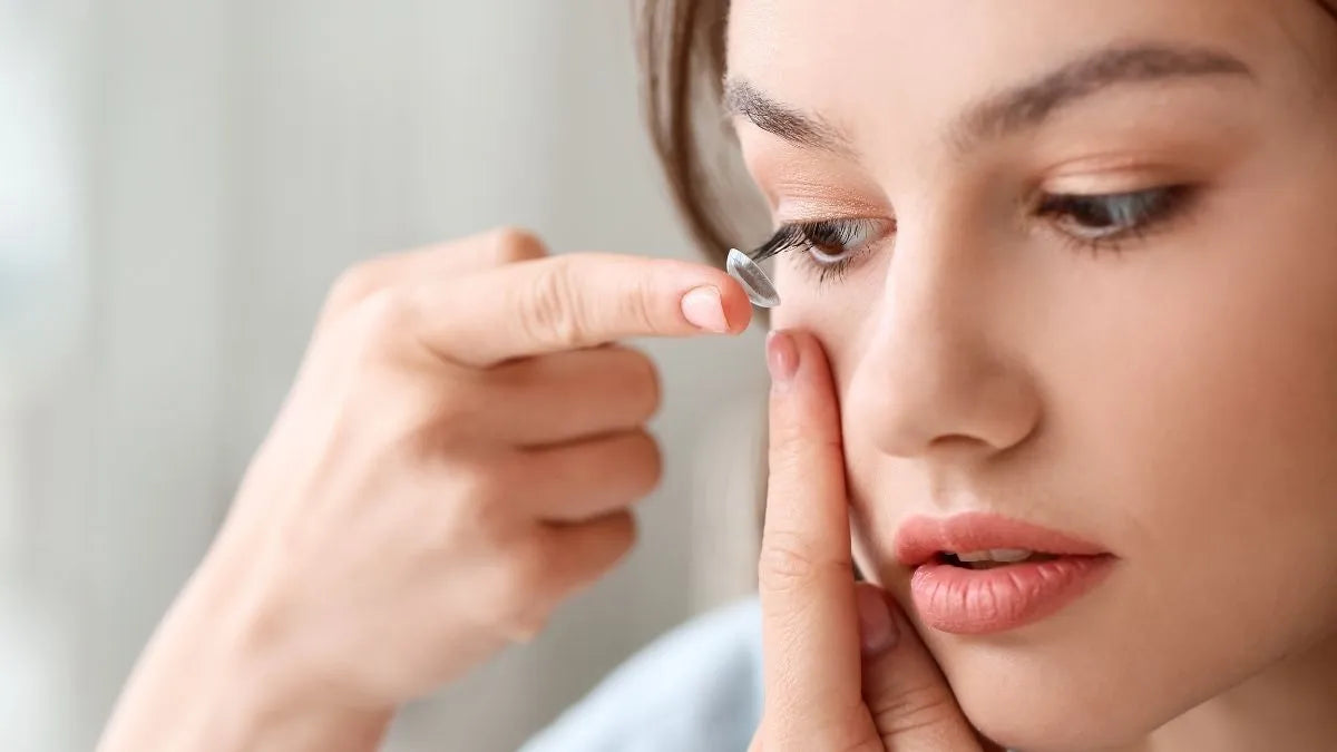 Contact lens wearer applying makeup