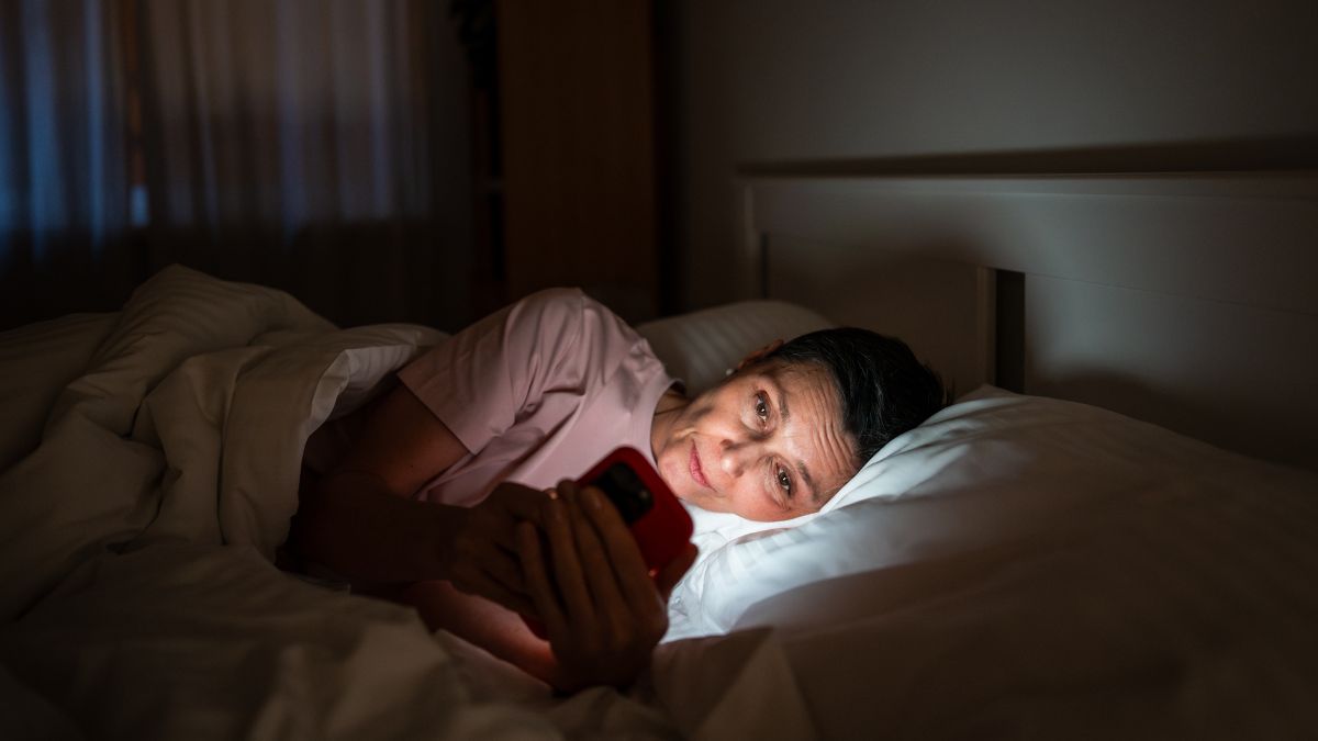 Person using a screen device with blue light reaching the eyes