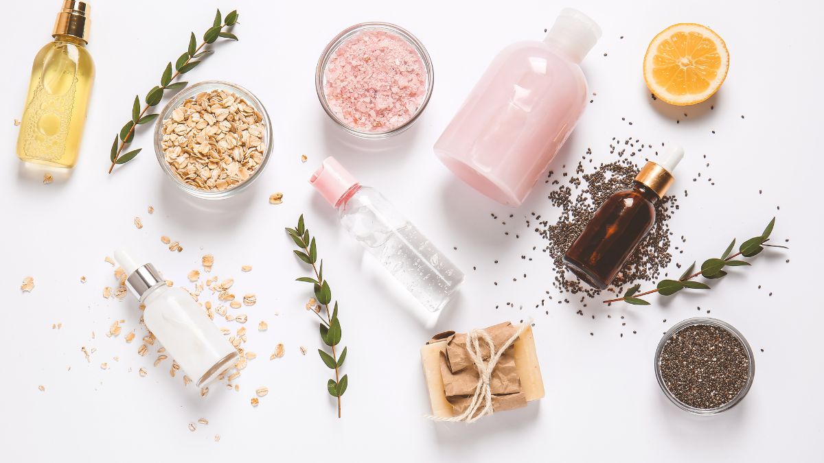 Cosmetic_ingredients._Colourful_powders_in_bowls._Light_pink_light_brown_powders_and_bottle_lying_on_a_table.