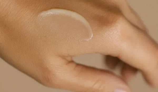 QueenBee Secrets balm texture swatched on the back of a hand
