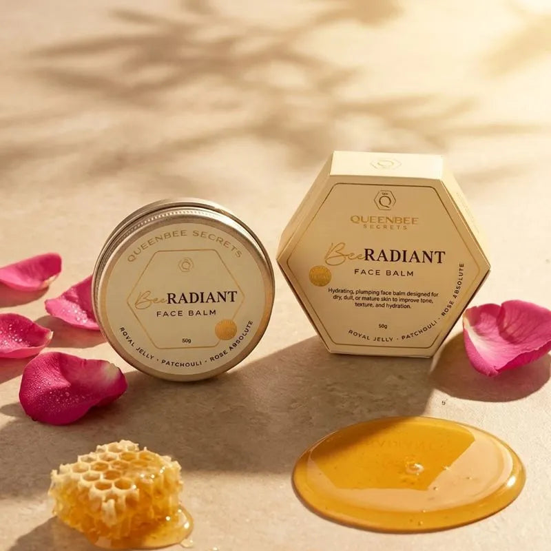 QueenBee Secrets BEE Radiant Face Balm 50g gold tin and cream hexagonal box