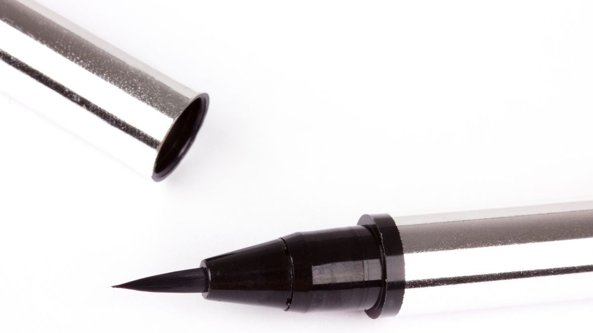 close_view_of_black_felt_tip_eyeliner._silver_lid_and_body._like_eyes_are_the_story.