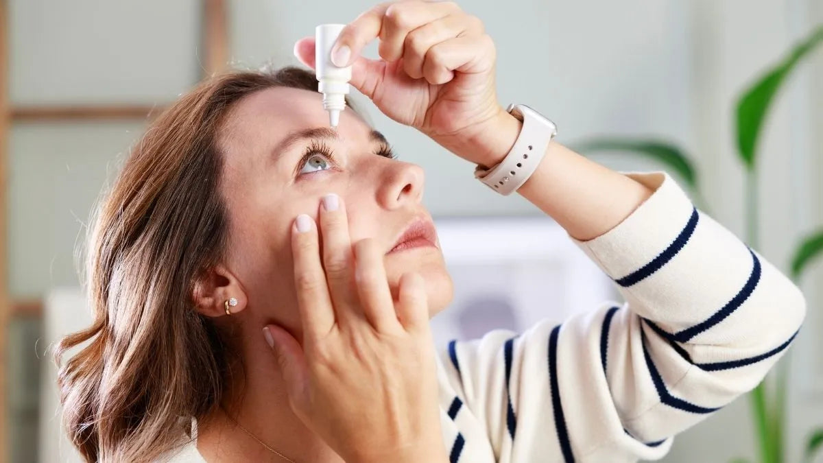 Person applying eye drops correctly